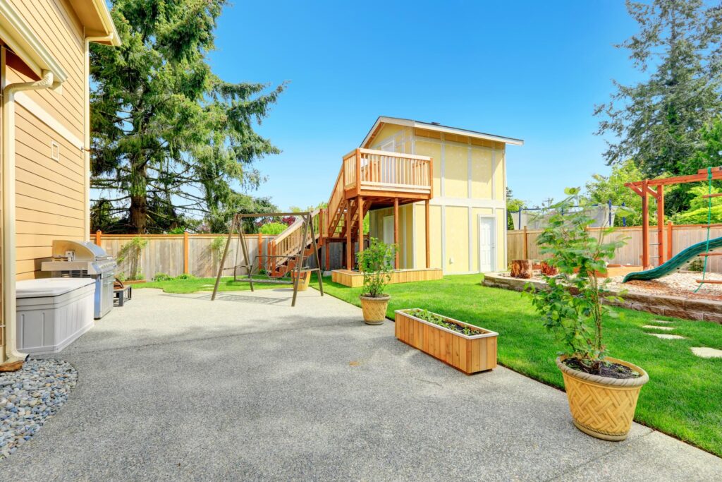 house made out of wood with small playground area